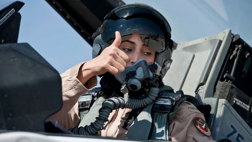 Mariam Al Mansouri, the first Emirati female fighter jet pilot, gives the thumbs up as she sits in the cockpit of an aircraft in United Arab Emirates June 13, 2013.