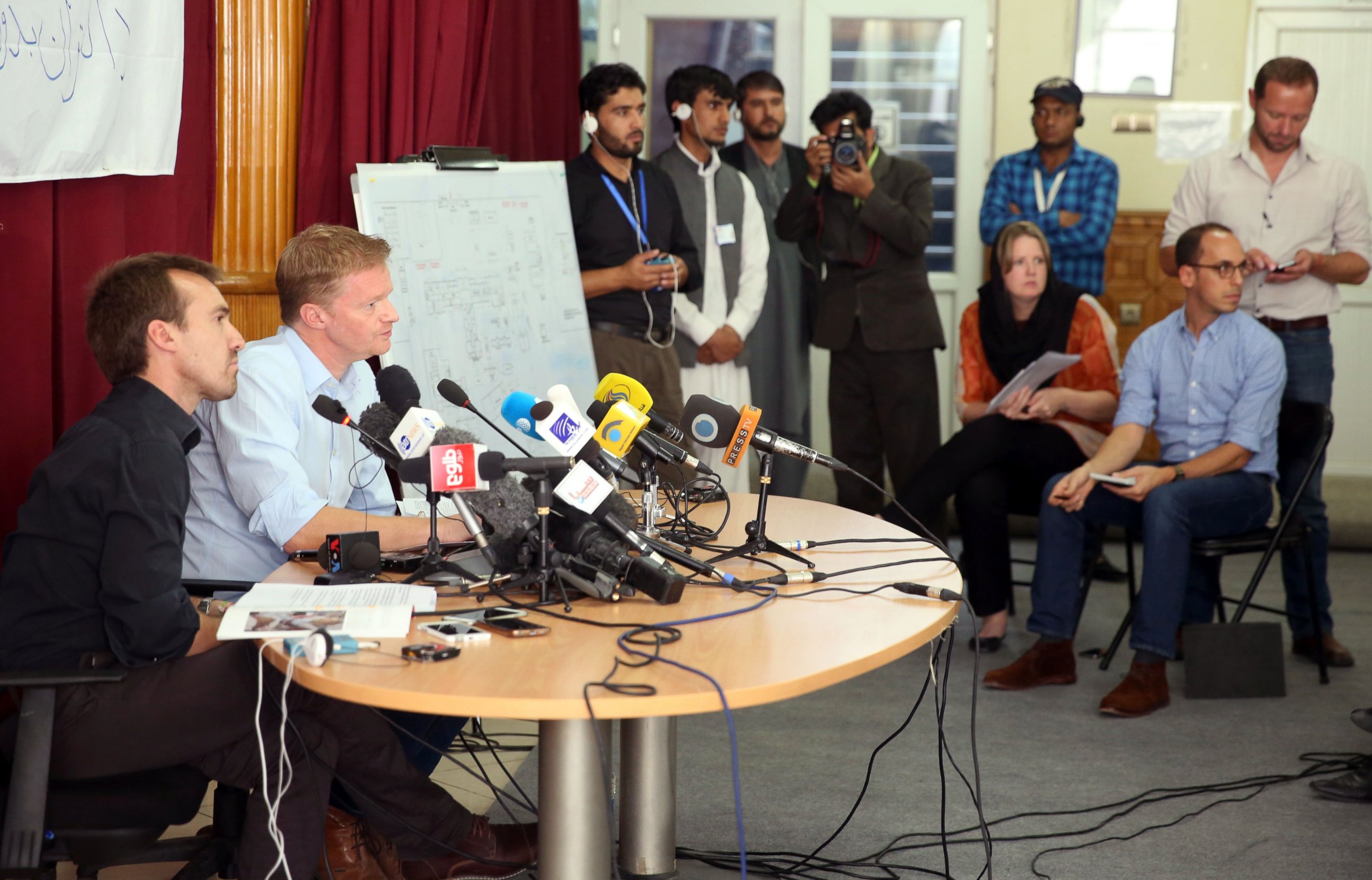 PHOTO: The general director of Medecins Sans Frontieres, Christopher Stokes, right, and MSF's Country Representative for Afghanistan, Guilhem Molinie, left, listen to questions during a press conference at their office in Kabul, Afghanistan, Oct. 8, 2015.