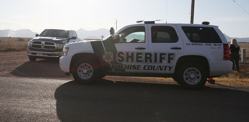 PHOTO: Cochise County Sheriff blocks the road on June 25, 2015, miles away from the site where an F-16 Fighting Falcon crashed near Douglas, Ariz.