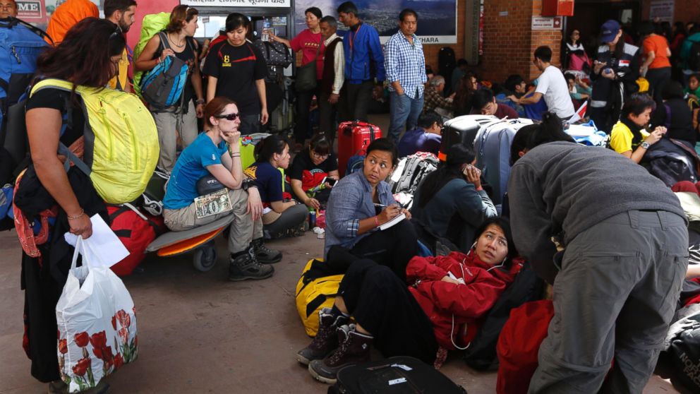 Foreign tourists and climbers wait for their flights at the Nepal International airport in Kathmandu, Nepal, April 27, 2015. 