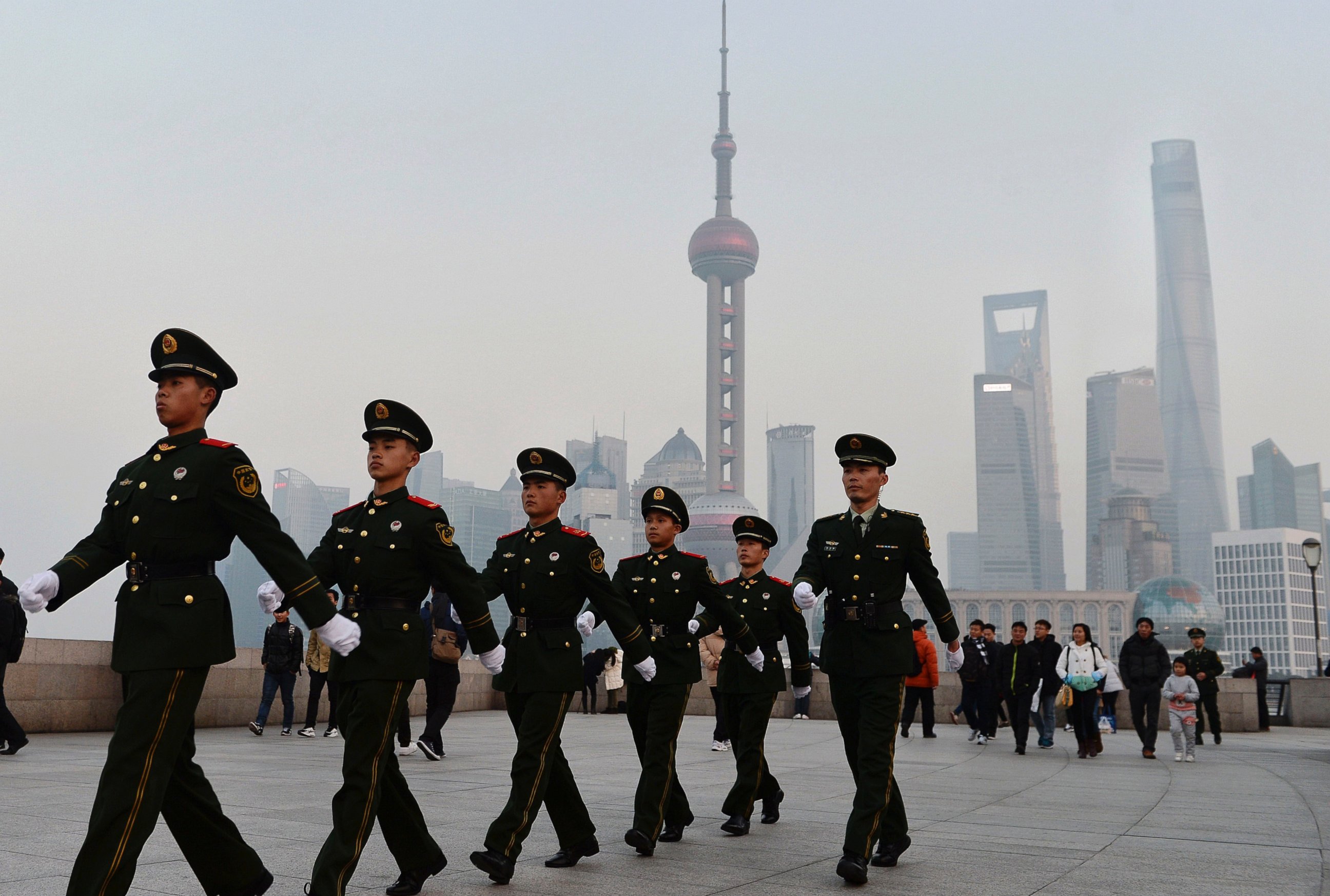 PHOTO: Chinese paramilitary police personnel patrol along the Bund, a popular tourist attraction in Shanghai, China, Dec. 31, 2015.