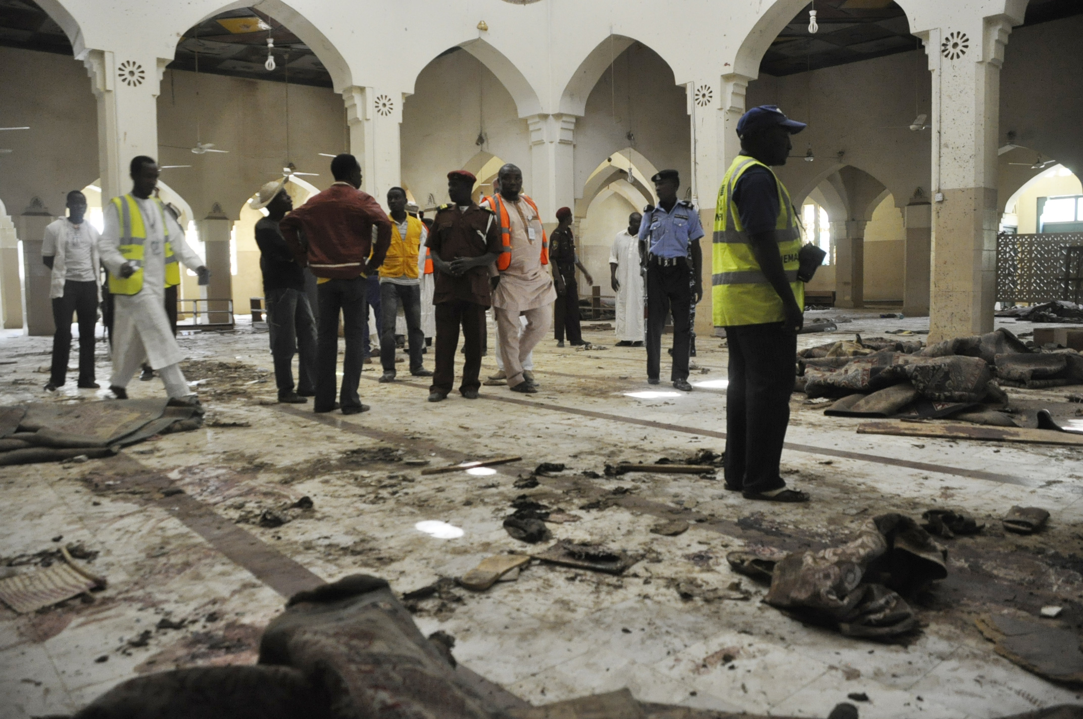 PHOTO: People inspect the central mosque following a bomb explosion in Kano, Nigeria, Nov. 29, 2014. No group claimed responsibility for the attack but as it bears the hallmarks of past attacks by Boko Haram, many assume that group to be responsible.
