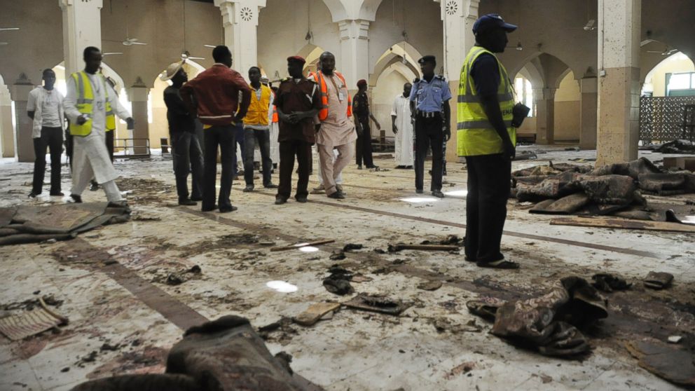 PHOTO: People inspect the central mosque following a bomb explosion in Kano, Nigeria, Nov. 29, 2014. No group claimed responsibility for the attack but as it bears the hallmarks of past attacks by Boko Haram, many assume that group to be responsible.