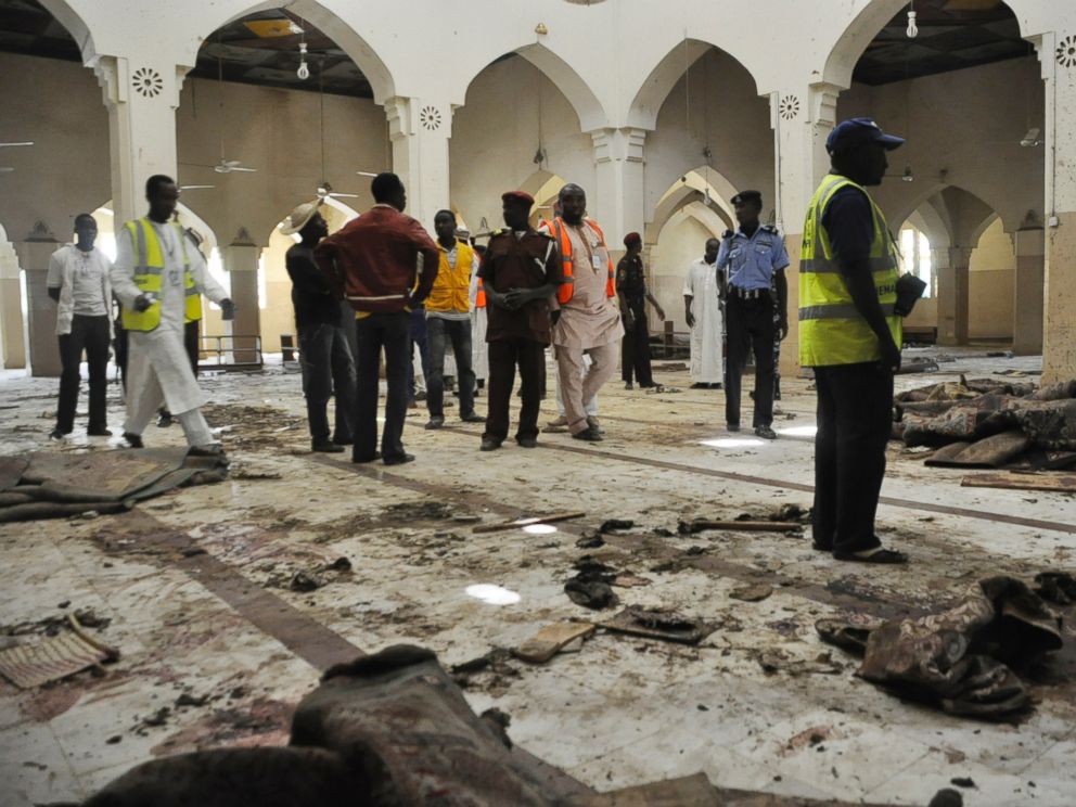 PHOTO: People inspect the central mosque following a bomb explosion in Kano, Nigeria, Nov. 29, 2014. No group claimed responsibility for the attack but as it bears the hallmarks of past attacks by Boko Haram, many assume that group to be responsible.