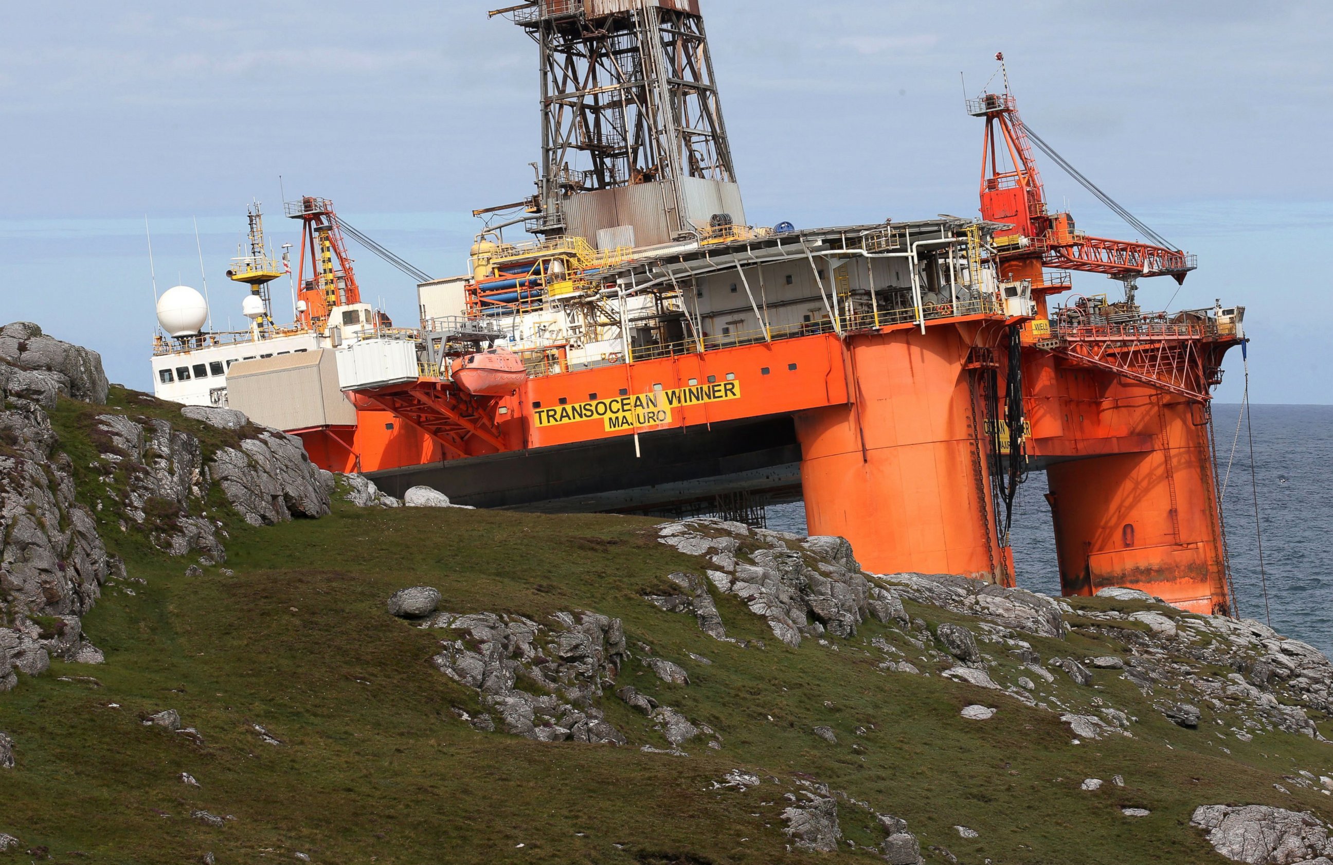 PHOTO: The Transocean Winner drilling rig stands proud from a spit of land off the coast of the Isle of Lewis, Scotland, after it ran aground in severe weather conditions, Aug. 9, 2016.