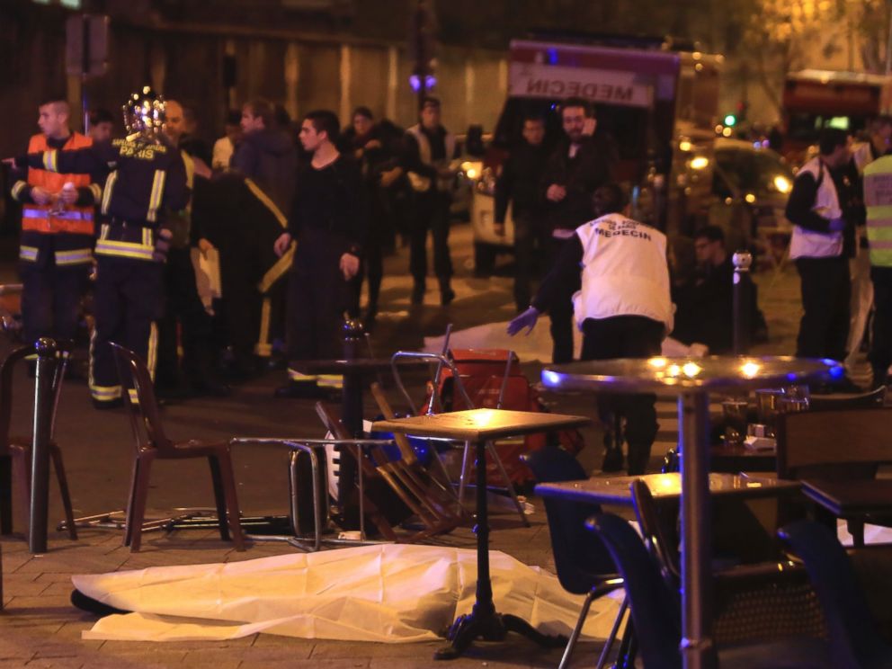 PHOTO: Rescue workers and medics work by victims at a Paris restaurant, Nov. 13, 2015.