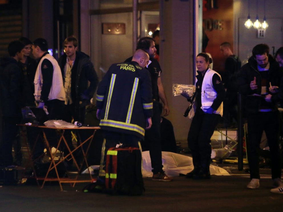 PHOTO: Rescue workers and medics work on victims outside a Paris restaurant, Nov. 13, 2015.