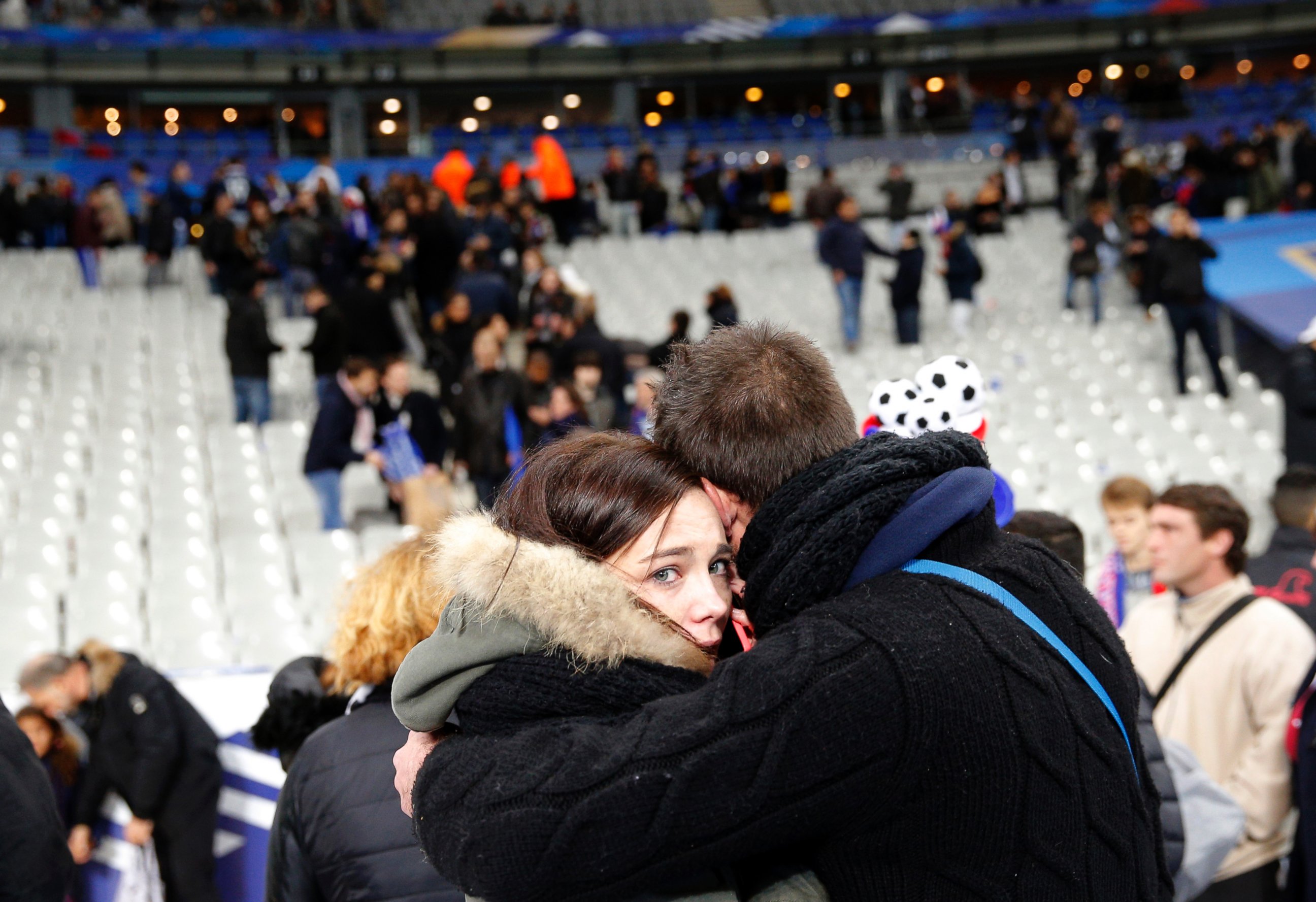 PHOTO: A supporter comforts a friend after invading the pitch of the Stade de France stadium at the end of the international friendly soccer match between France and Germany in Saint Denis, outside Paris, Nov. 13, 2015.