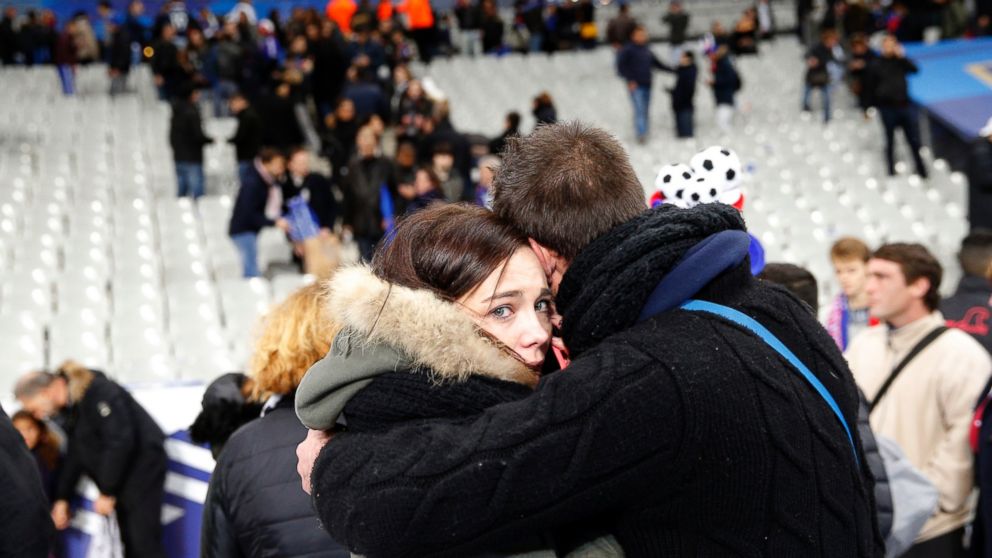 PHOTO: A supporter comforts a friend after invading the pitch of the Stade de France stadium at the end of the international friendly soccer match between France and Germany in Saint Denis, outside Paris, Nov. 13, 2015.