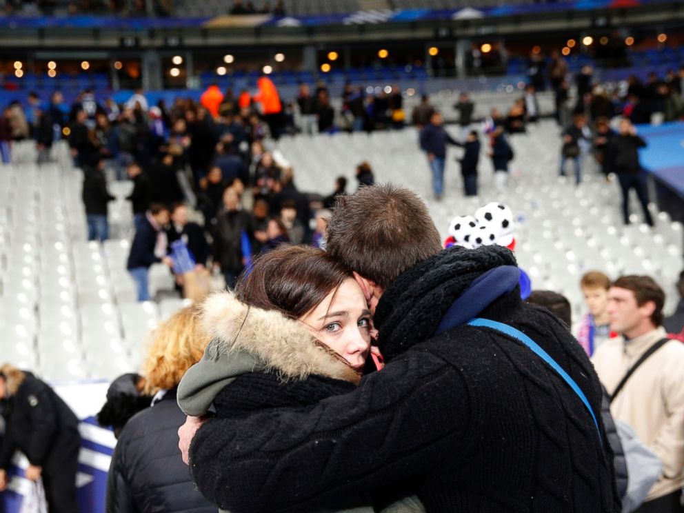 PHOTO: A supporter comforts a friend after invading the pitch of the Stade de France stadium at the end of the international friendly soccer match between France and Germany in Saint Denis, outside Paris, Nov. 13, 2015.