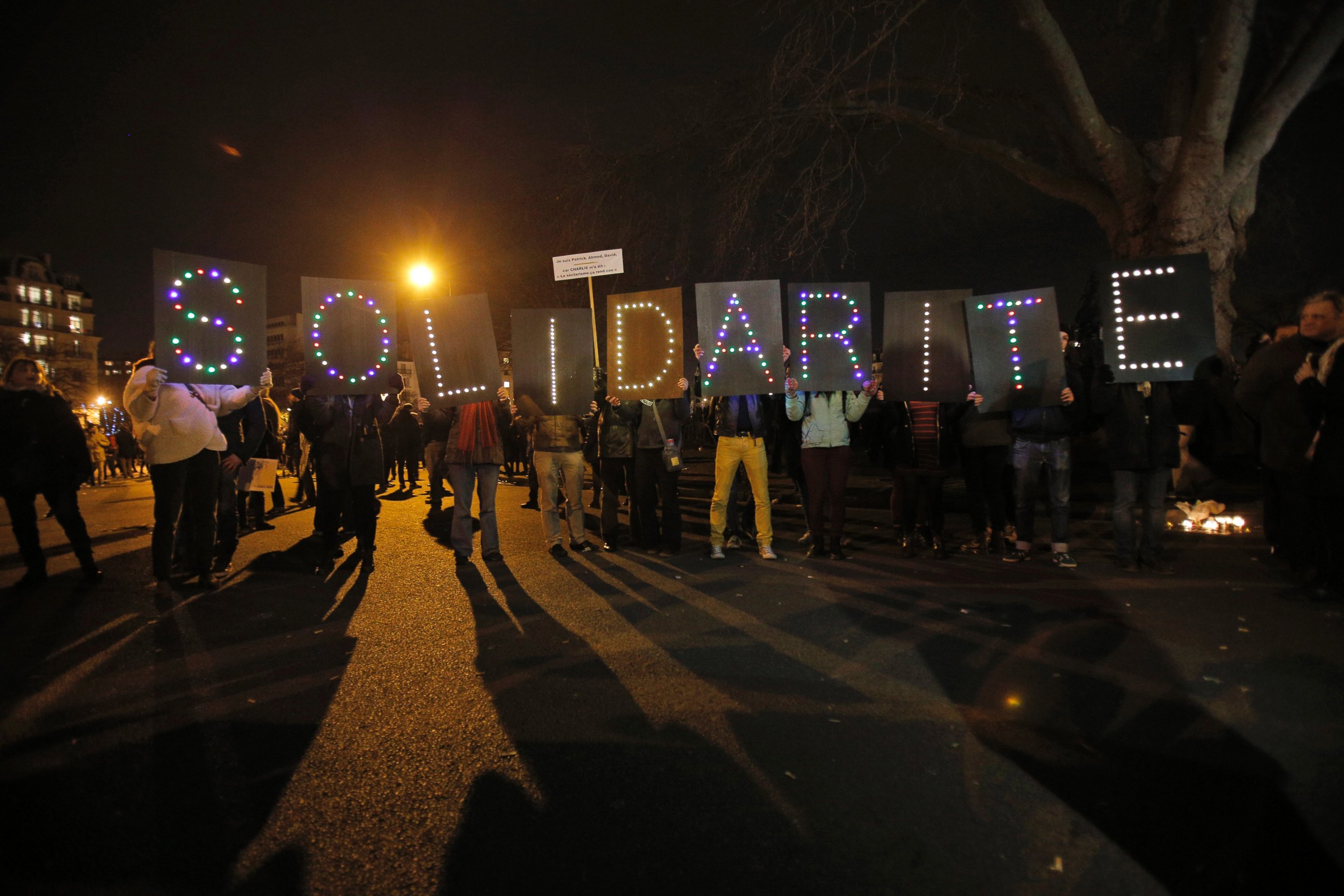 PHOTO: People hold up a sign reading "Solidarity" during a rally in Paris, France, Sunday, Jan. 11, 2015.