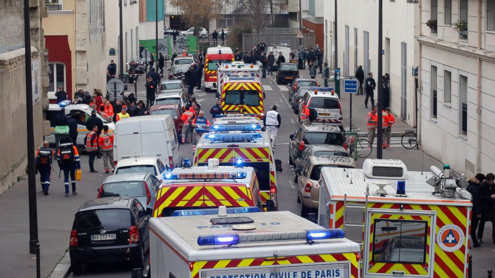 PHOTO: Ambulances gather in the street outside the French satirical newspaper Charlie Hebdo's office, in Paris, Jan. 7, 2015. 