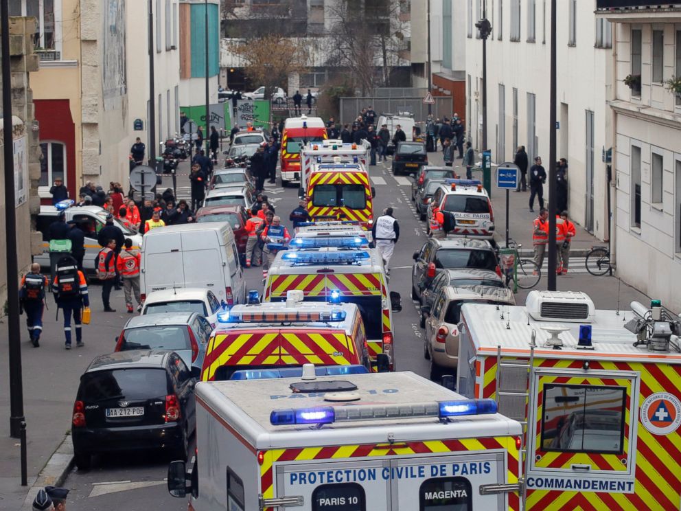 PHOTO: Ambulances gather in the street outside the French satirical newspaper Charlie Hebdos office, in Paris, Jan. 7, 2015.