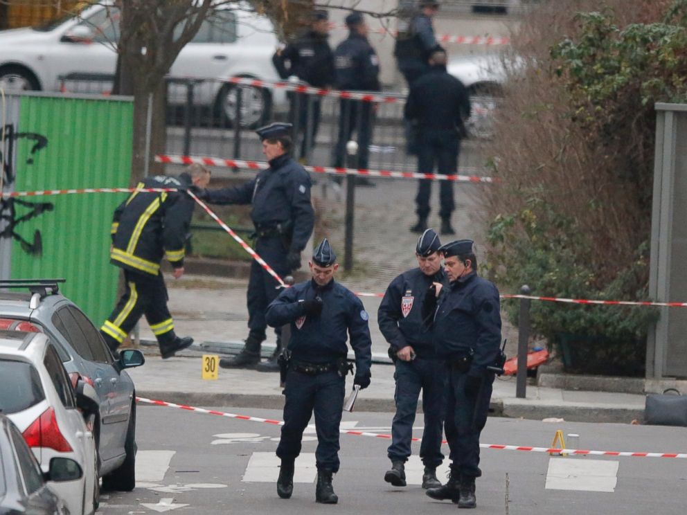 PHOTO: French Police officers gather outside the French satirical newspaper Charlie Hebdos office, in Paris, Jan. 7, 2015.