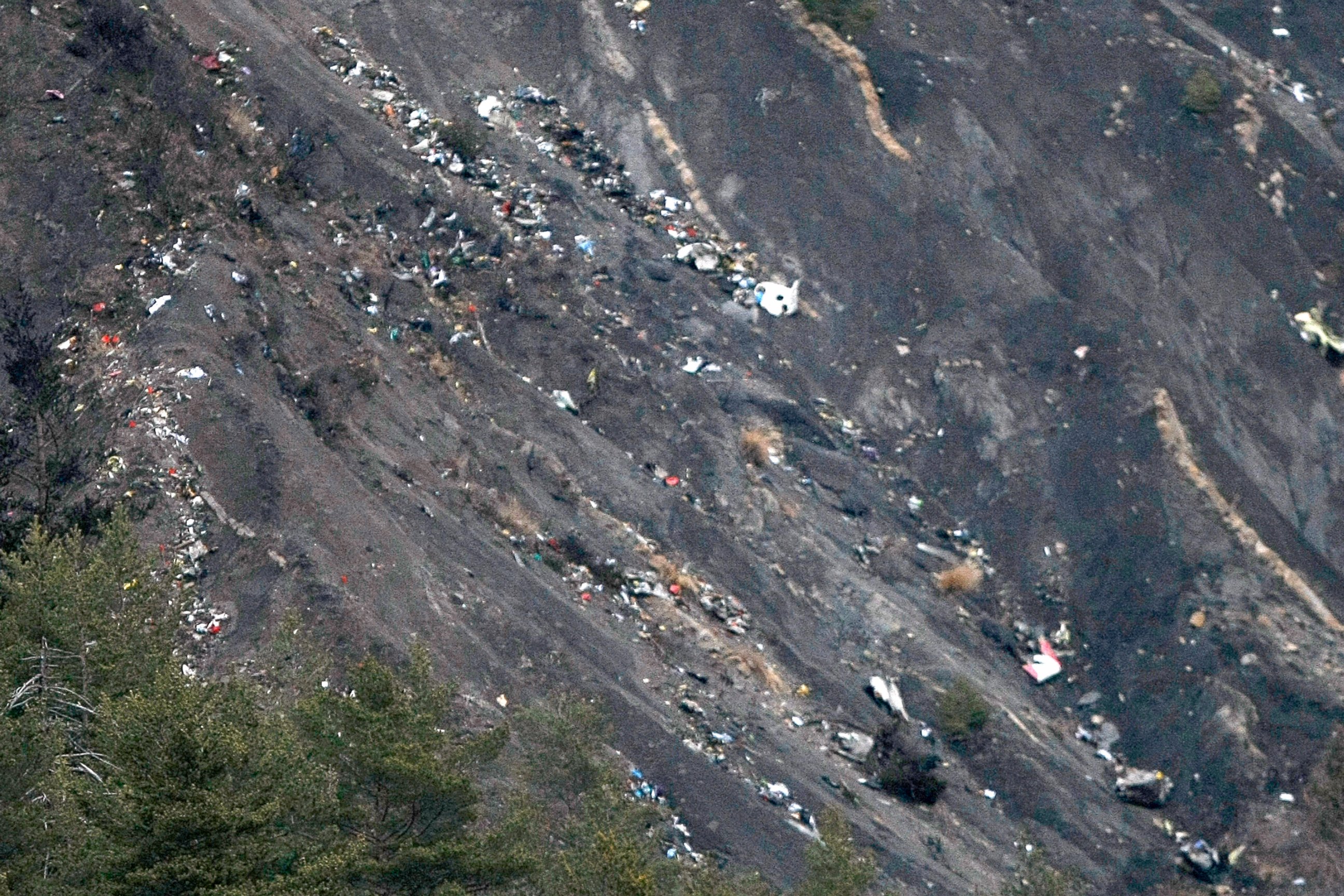 PHOTO: Debris of the Germanwings passenger jet is scattered on the mountain side near Seyne les Alpes, French Alps, March 24, 2015. 