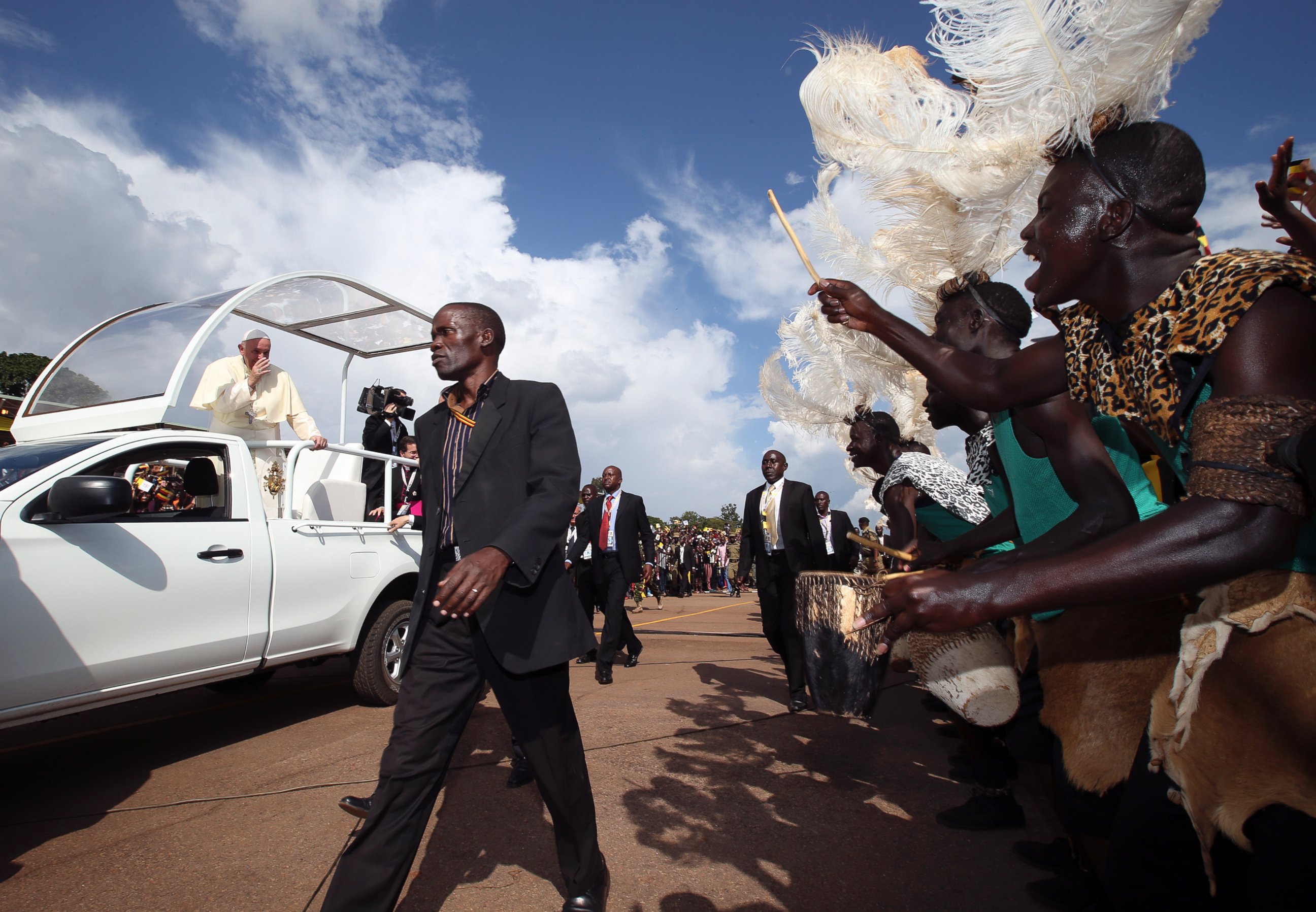 PHOTO: Pope Francis waves from the popemobile to meet with youths in Kampala, Uganda, on Nov. 28, 2015.