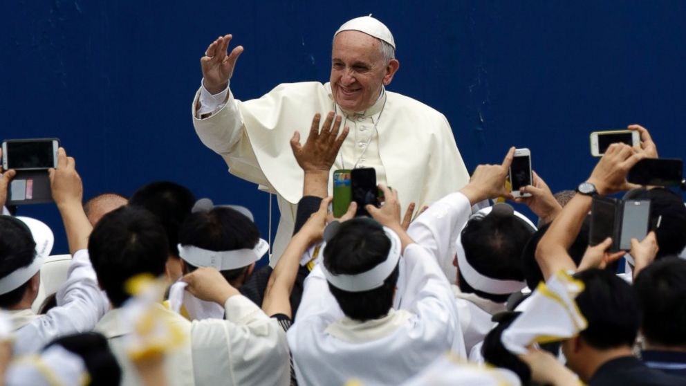 Pope Francis is greeted by supporters for the Mass of Assumption of Mary at Daejeon World Cup stadium in Daejeon, south of Seoul, South Korea, Aug. 15, 2014.
