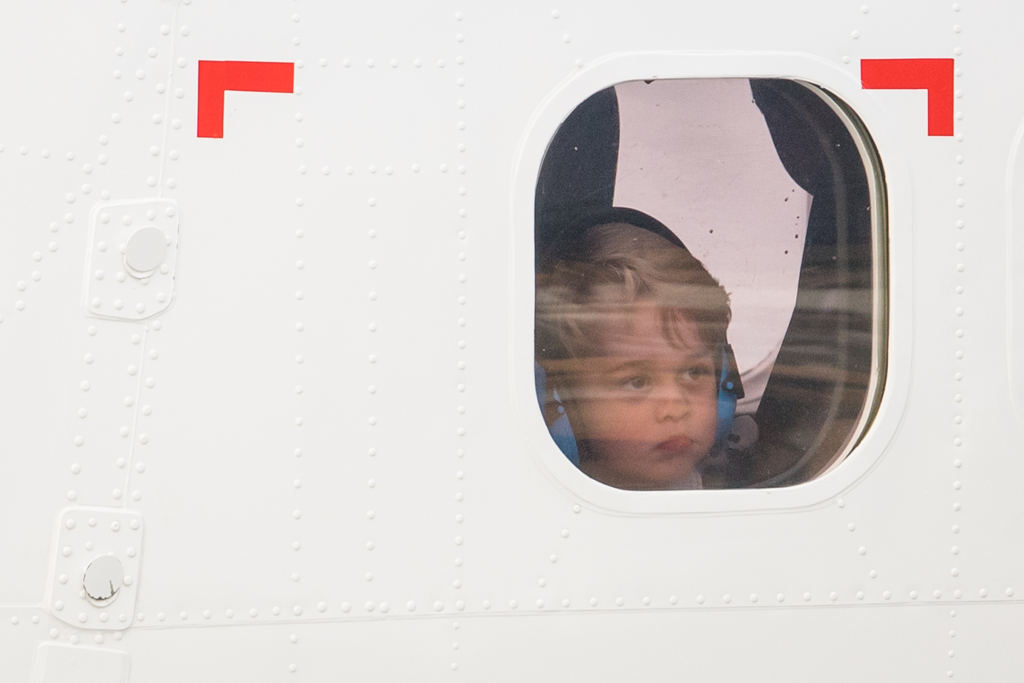 PHOTO: Royal Visit to Canada - Day Eight. Prince George looks out of the window of a float plane as he departs from Victoria Harbour Airport in Victoria, Canada, on the eighth day of the Royal Tour to Canada, on October 1, 2016.