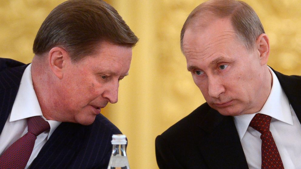 PHOTO: Russian President Vladimir Putin listens to his chief of staff Sergei Ivanov during a meeting in the Kremlin in Moscow, Russia, March 24, 2014.