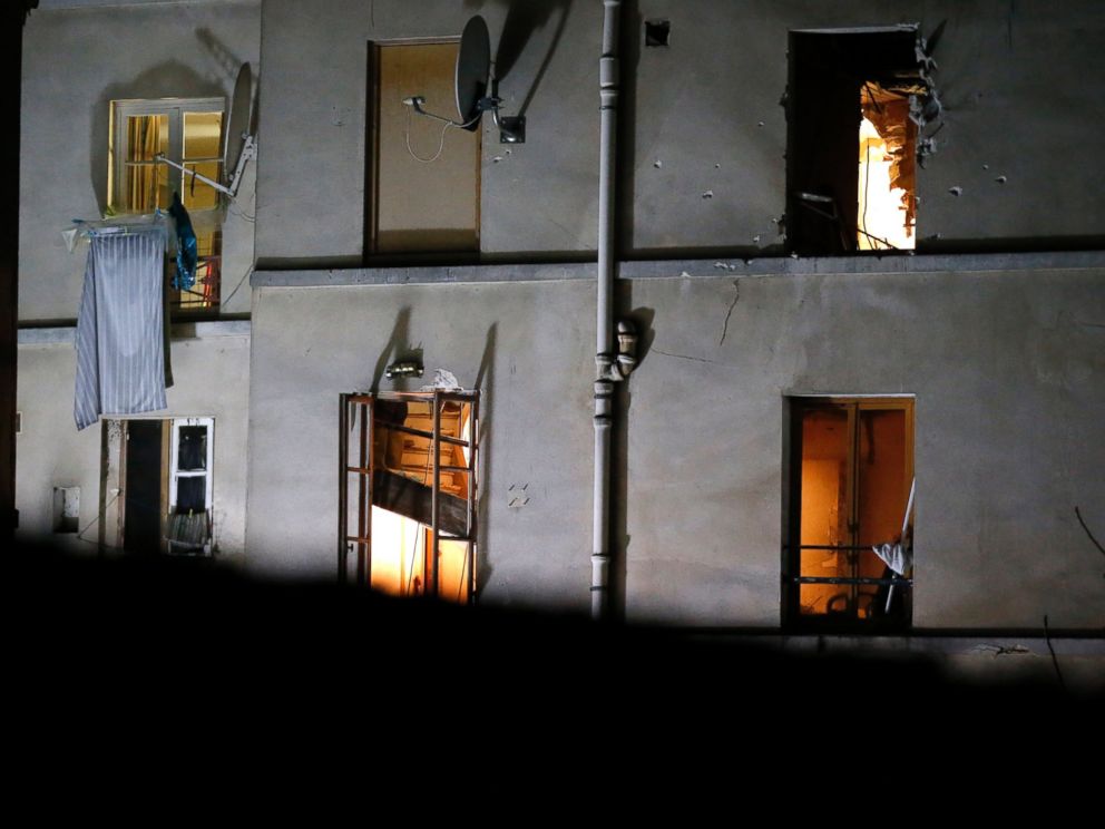 PHOTO: Bullet holes and smashed windows are seen on the back side of a building after it was raided by security forces in Saint-Denis, near Paris, Nov. 18, 2015.