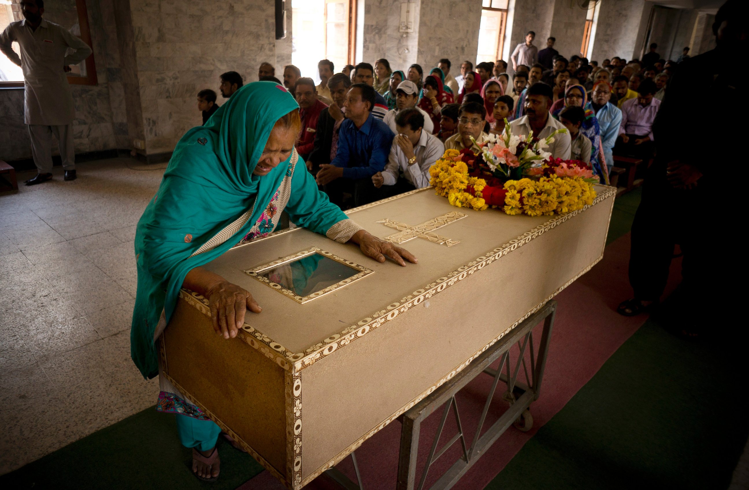 PHOTO: The grandmother of a Pakistani Christian boy named Sahil Pervez, mourns his death, at a church in Lahore, Pakistan, March 28, 2016.