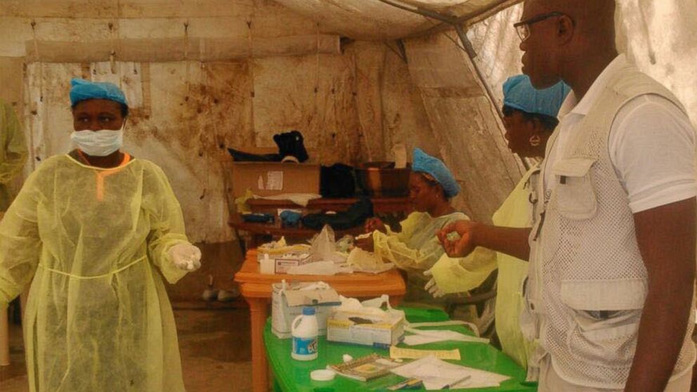 PHOTO: In this photo taken on July 27, 2014,  medical personnel work at the Doctors Without Borders facility in Kailahun, Sierra Leone. 