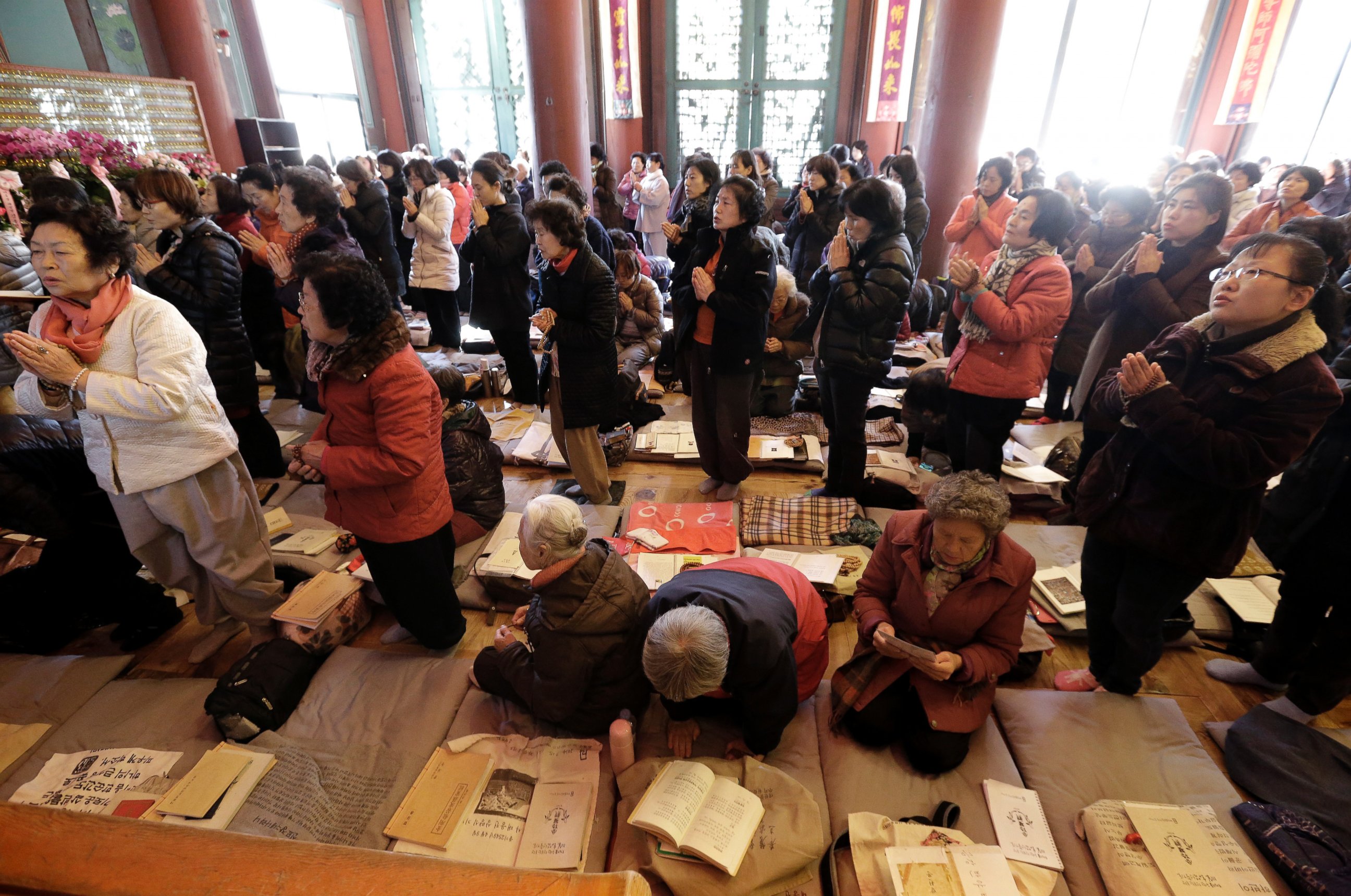 PHOTO: Parents pray to wish for their children' success in the Scholastic Aptitude Test at the Jogye Temple in Seoul, South Korea, Nov. 13, 2104. 
