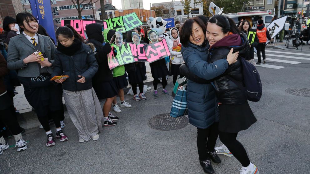 PHOTO: A teacher hugs her student, right, wishing her success in the Scholastic Aptitude Test in front of the main gate of an examination hall in Seoul, South Korea, Nov. 13, 2014. 