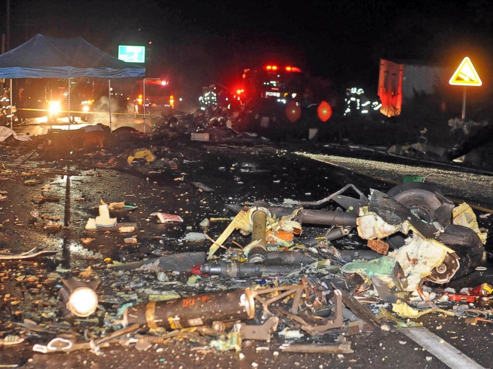 PHOTO: The wreckage of a U.S. military AH-64 Apache helicopter is strewn along a road in Wonju, South Korea, Nov. 23, 2015.
