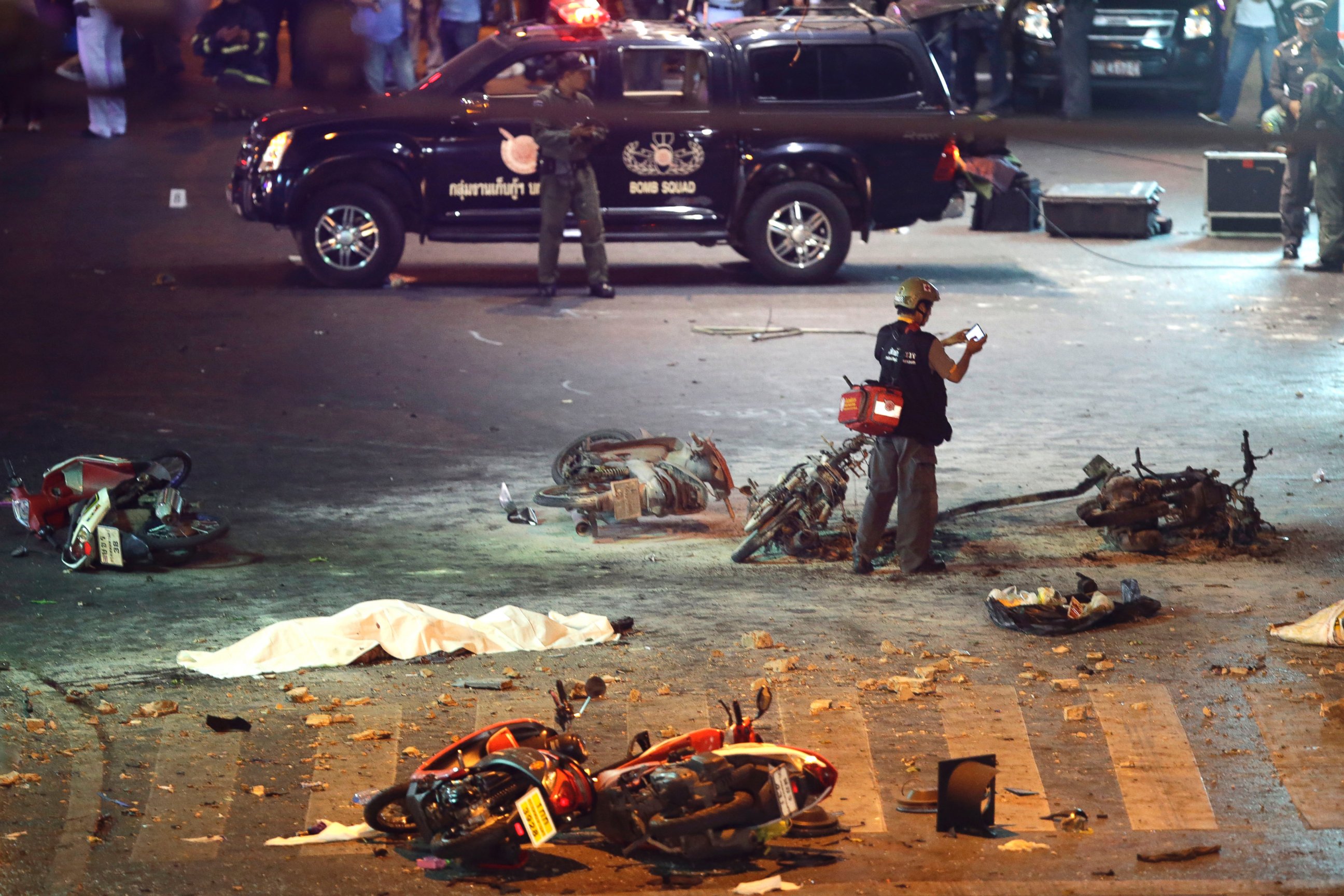 PHOTO: A policeman photographs debris from an explosion in central Bangkok, Thailand, Aug. 17, 2015.