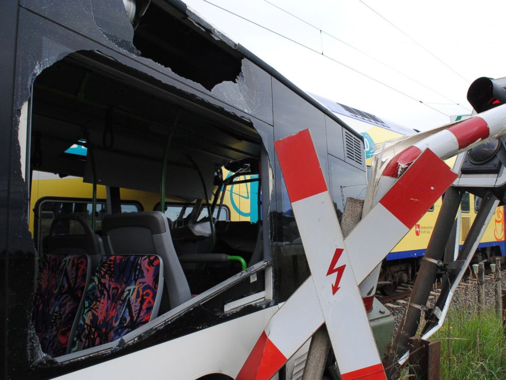 PHOTO: A demolished school bus is pictured next to a railway crossing where it was hit by a train in Helendorf, Germany, Sept. 16, 2015.