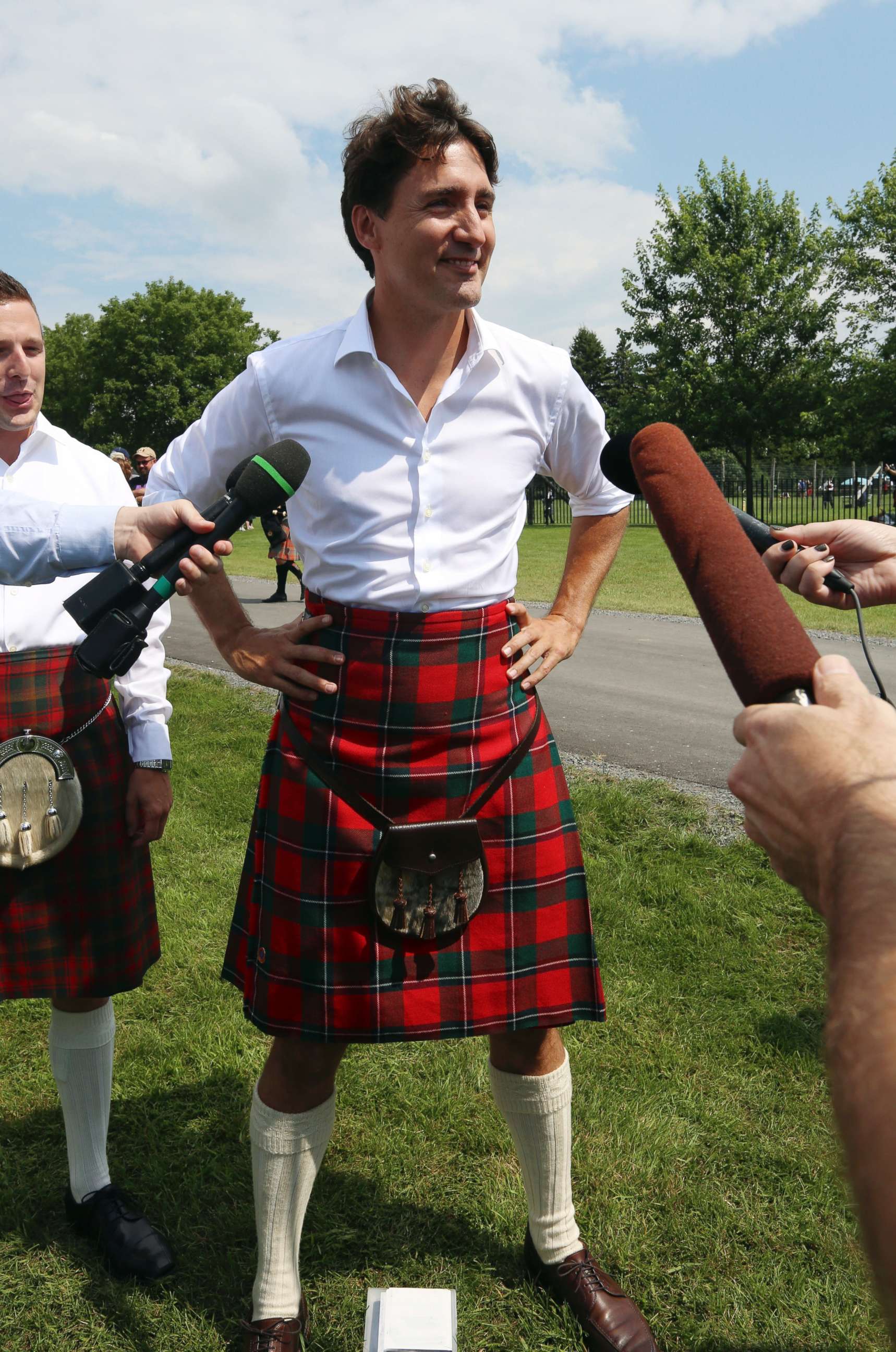 PHOTO: Canada Prime Minister Justin Trudeau, wearing kilt, talks to reporters while attending the 70th annual Glengarry Highland Games in Maxville, Ontario, Friday, Aug. 4, 2017. 