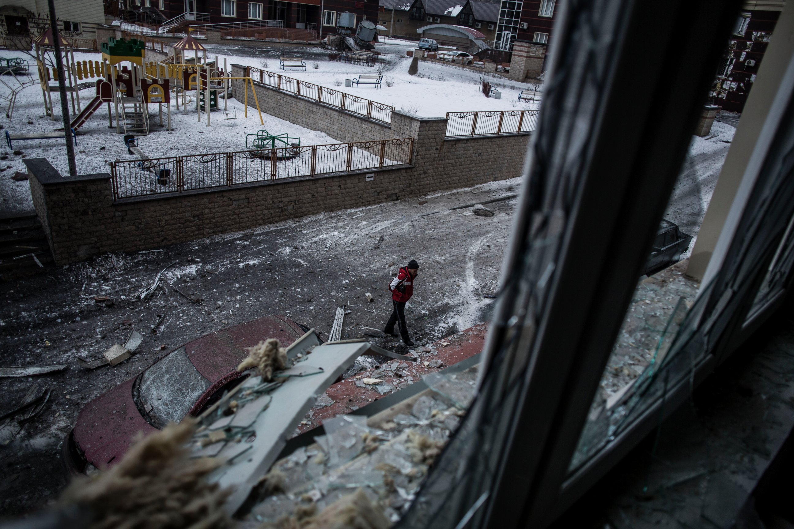 PHOTO: A Ukrainian man walks through the debris produced after the Ukrainian Army hit a building in Voroshilovsky area, center of Donetsk, Ukraine, Jan. 18, 2015.