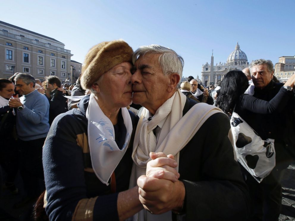 PHOTO: A couple dances tango in front of St. Peters Square to celebrate Pope Francis 78th birthday, at the Vatican on Dec. 17, 2014.