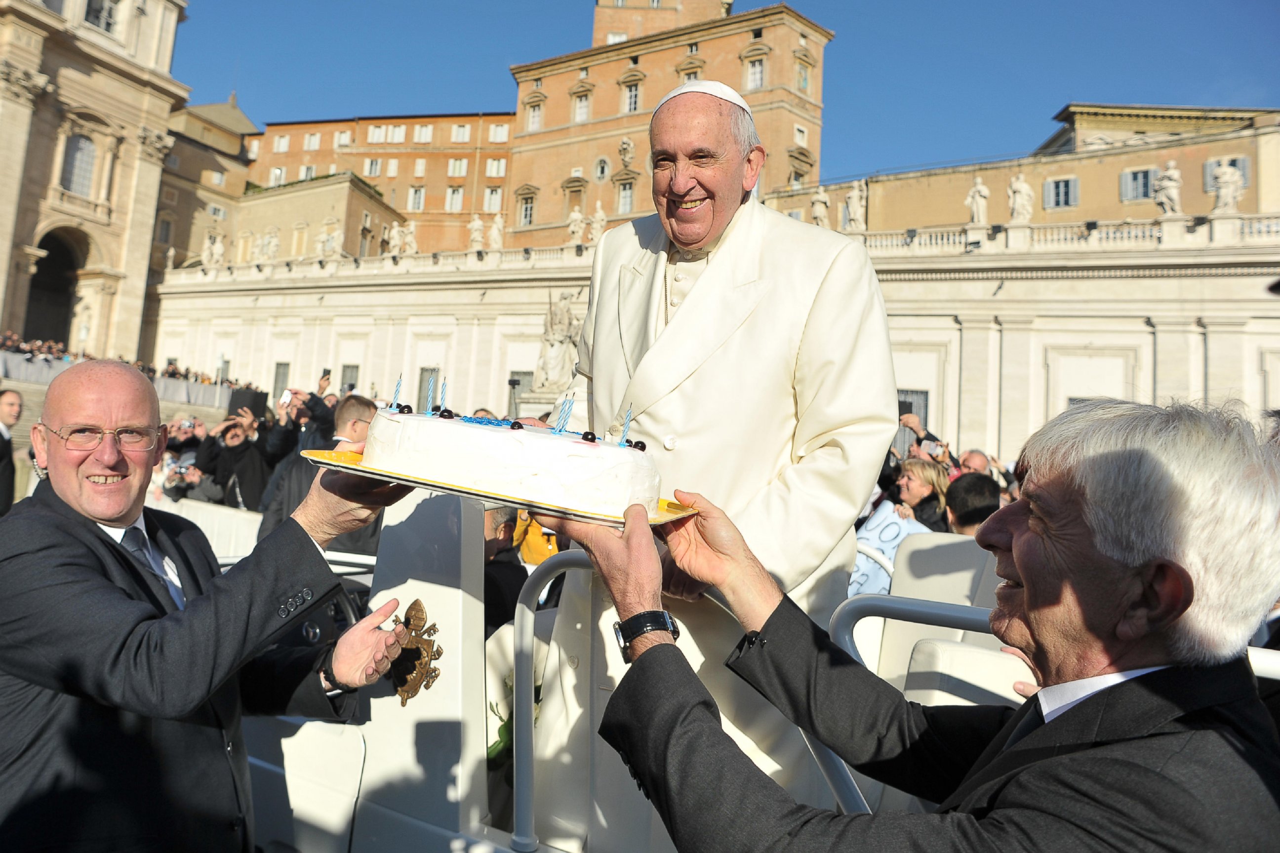 PHOTO: In this photo provided by Vatican newspaper L'Osservatore Romano, Pope Francis is presented with a cake during his weekly general audience in St. Peter's Square at the Vatican on Dec. 17, 2014.