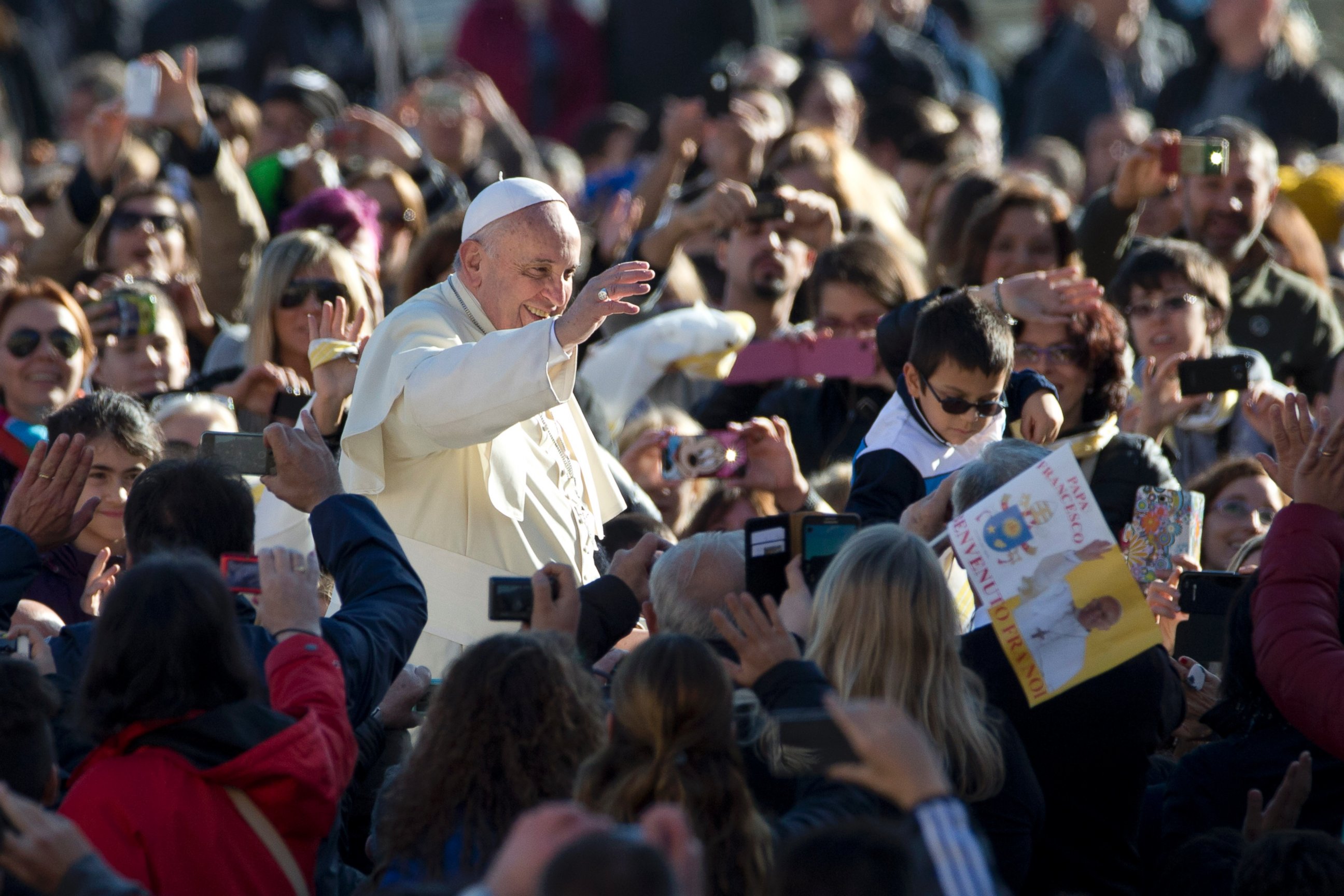 PHOTO: Pope Francis waves to faithful as he arrives for his weekly general audience, in St. Peter's Square at the Vatican, on Nov. 19, 2014.
