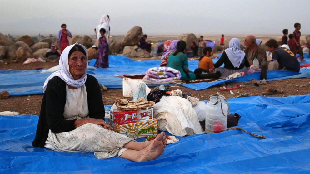 Displaced Iraqis from the Yazidi community settle at a camp at Derike, Syria, Sunday, Aug. 10, 2014.