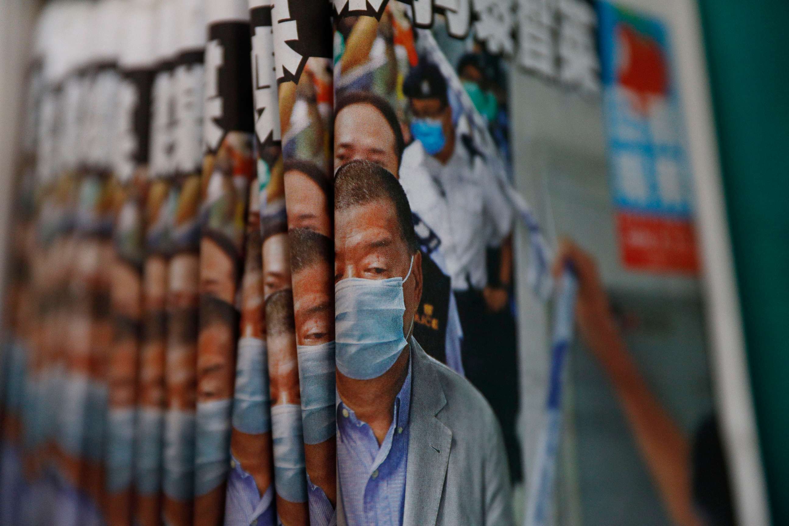 PHOTO: Copies of Apple Daily newspaper with front pages featuring Hong Kong media tycoon Jimmy Lai, are displayed for sale at a newsstand in Hong Kong Tuesday, Aug. 11, 2020. 