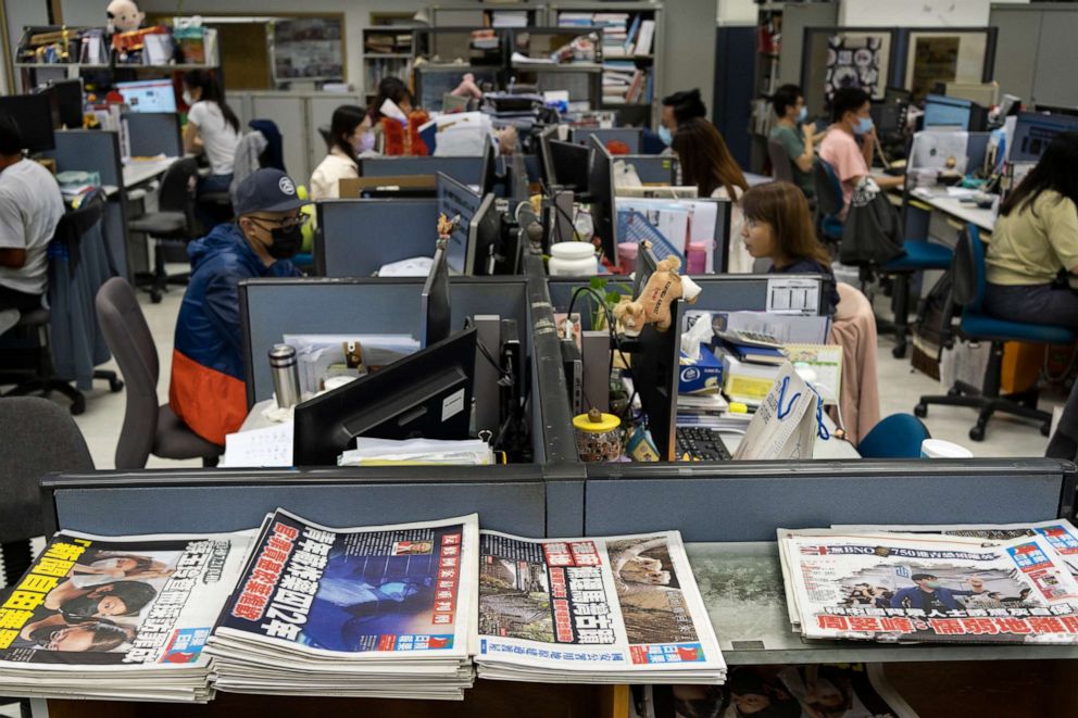 PHOTO: Reporters work at the news room of Apple Daily Monday, April 26, 2021, in Hong Kong. 