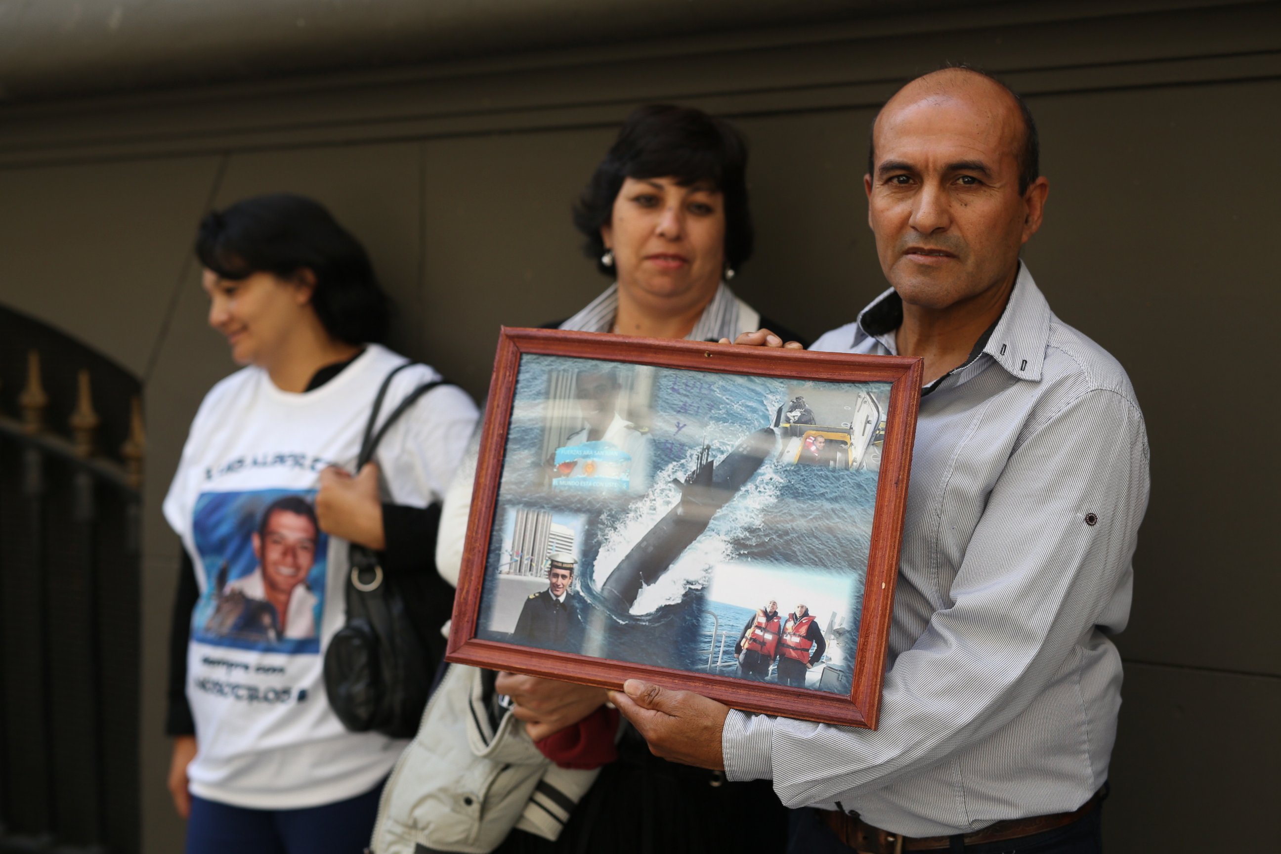 PHOTO: Antonio Niz, father of first Corporal Luis Niz, holds a collage of images of his son, a crew member of the missing ARA San Juan submarine, as family members stand outside Russia's embassy in Buenos Aires, Argentina, Monday, Jan. 15, 2018.