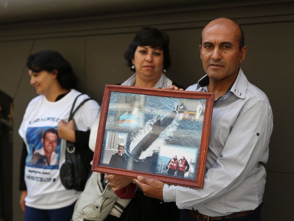 PHOTO: Antonio Niz, father of first Corporal Luis Niz, holds a collage of images of his son, member of the crew of the submarine ARA San Juan, missing, while family members stand in front of the Embassy of Russia in Buenos Aires, Argentina, Monday, January 15, 2018.