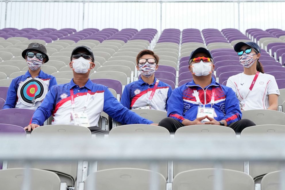 PHOTO: People sitting on the athletes' stand watch watch the men's team competition at the 2020 Summer Olympics, Monday, July 26, 2021, in Tokyo, Japan.