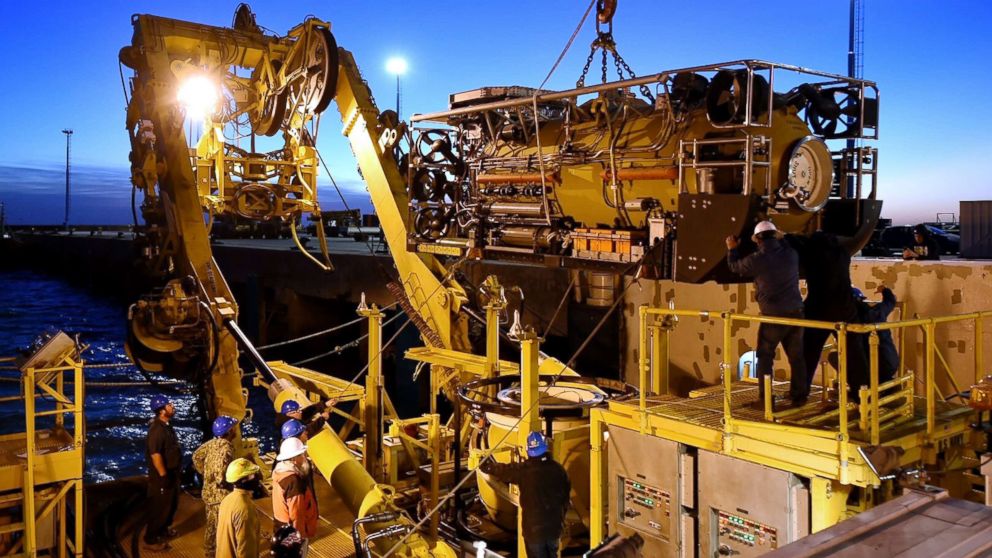 This handout picture released by U.S. Navy shows Undersea Rescue Command (URC) and Argentine construction workers preparing the motor vessel Sophie Siem for the installation of the Submarine Rescue Diving and Recompression System (SRDRS) to support the Argentine government's search and rescue efforts for the submarine ARA San Juan in Comodoro Rivadavia, Chubut, Argentina on Nov. 26, 2017.

