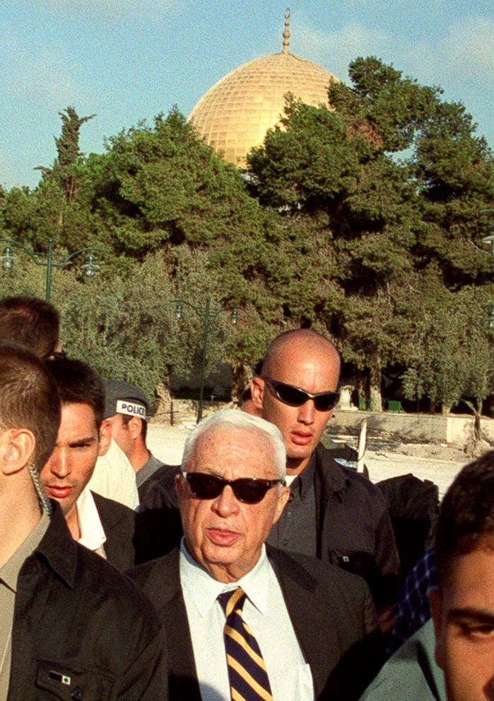 PHOTO: Ariel Sharon, center, is flanked by security guards as he visits the Al-Aqsa mosque compound in Jerusalem's Old City, Sept. 28, 2000. 