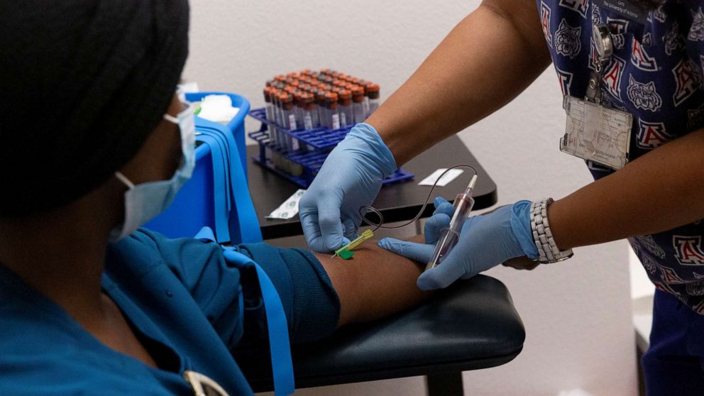 PHOTO: A heath care worker has her blood drawn for an antibody test for COVID-19 at the University of Arizona in Tucson, Arizona, July 10, 2020.