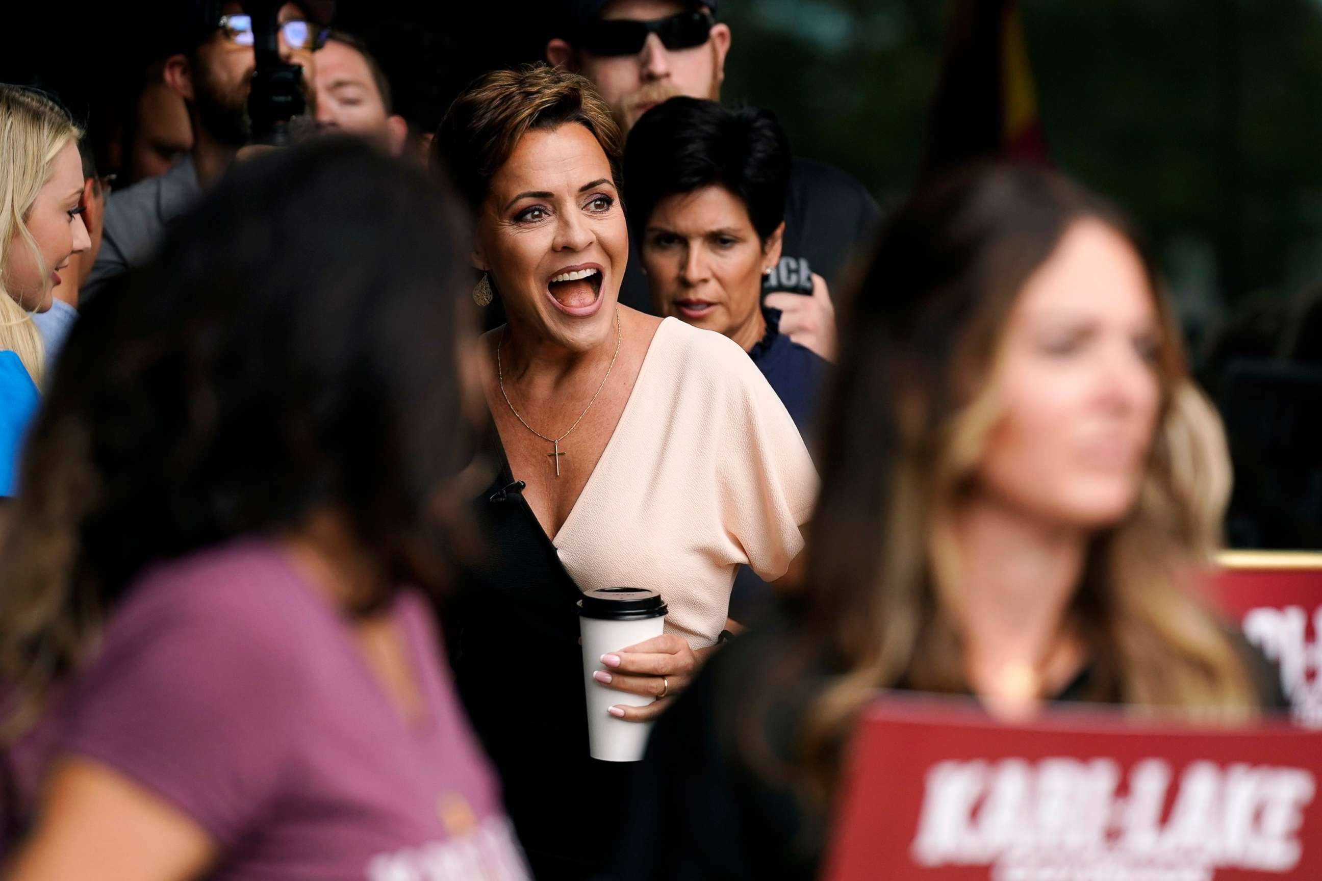 PHOTO: Kari Lake, Republican candidate for Arizona governor, smiles at supporters as she arrives to speak at a post-election news conference in Phoenix, Ariz., Aug. 3, 2022.