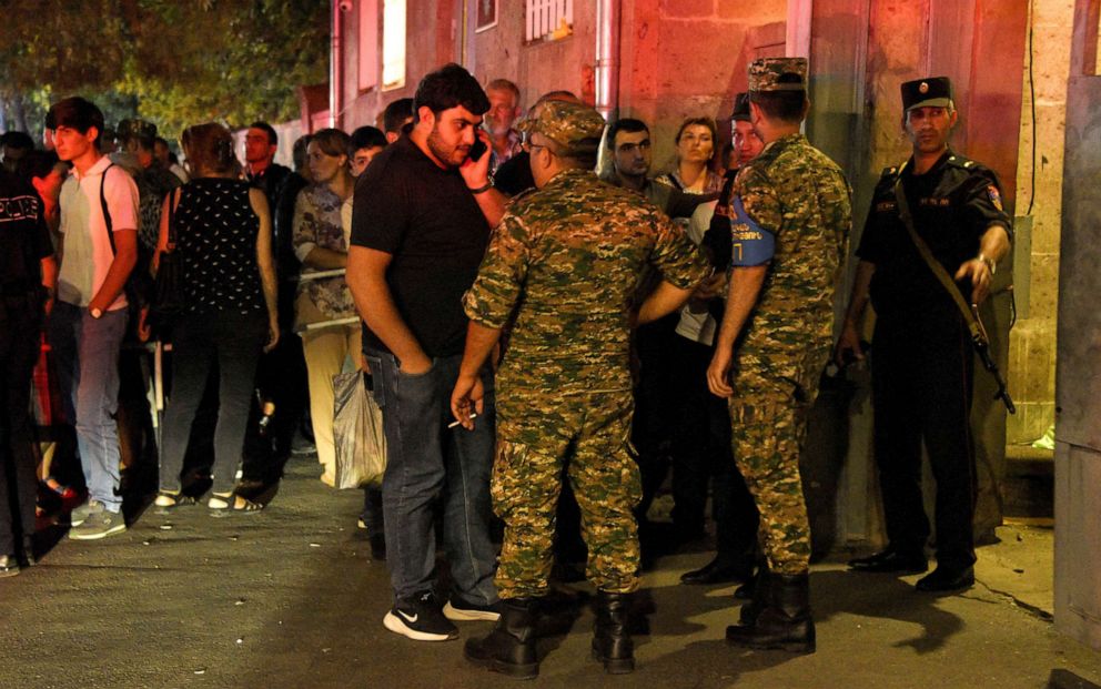 PHOTO: Relatives of soldiers injured during nighttime border clashes between Armenia and Azerbaijan gather outside a military hospital in Yerevan, September 13, 2022.
