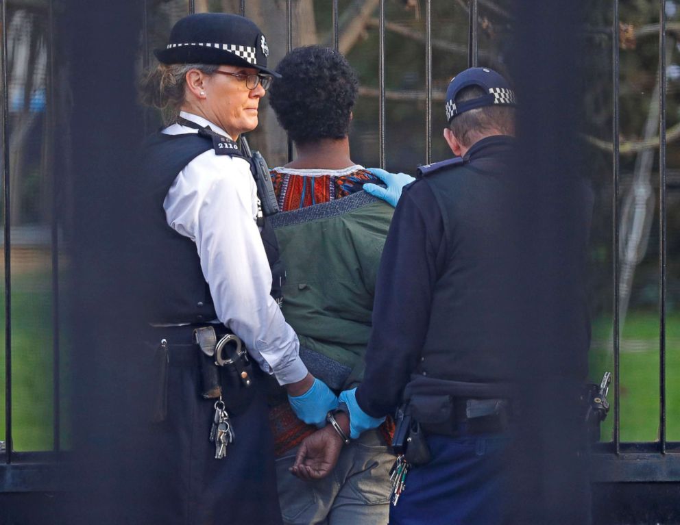 PHOTO: Police restrain a man inside the grounds of the Houses of Parliament in London, Dec. 11, 2018.