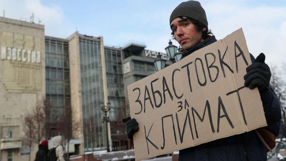 PHOTO: Climate activist Arshak Makichyan holds a cardboard reading "Strike for Climate" during a single-person demonstration in Moscow, Feb. 7, 2020.