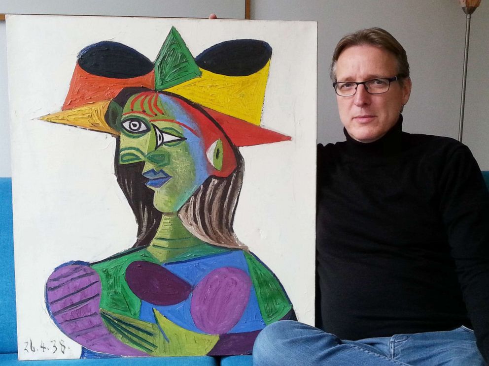 PHOTO: Dutch art detective Arthur Brand poses with the stolen Picasso painting Buste de Femme (Dora Maar), March 14, 2019, at his Amsterdam home.